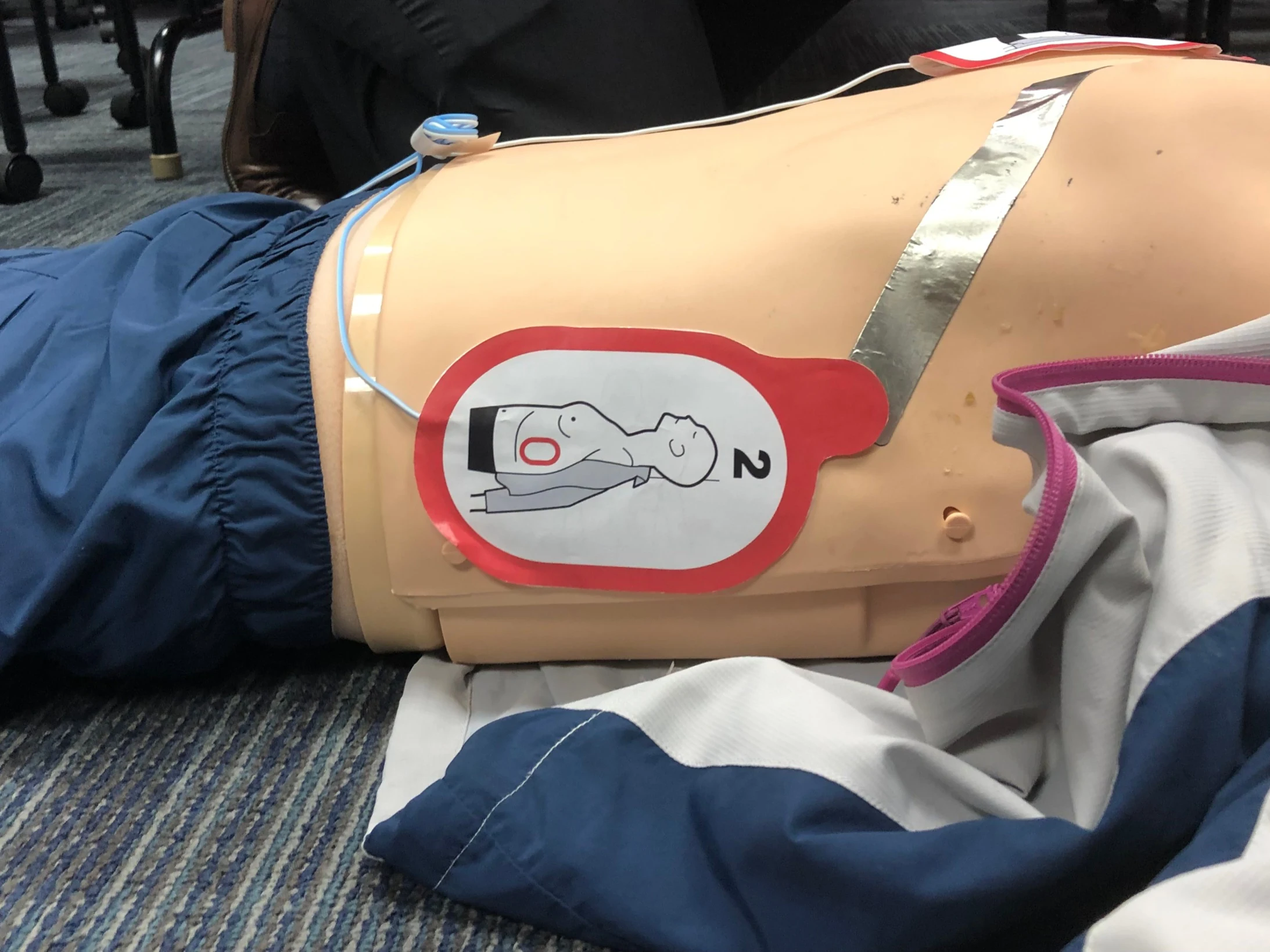 Responder placing FR3 pads on a mannequin
