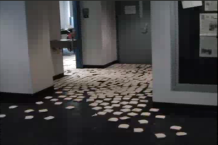 Slices of bread covering a hallway outside a RISD classroom